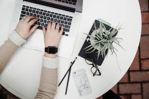 woman working on MacBook